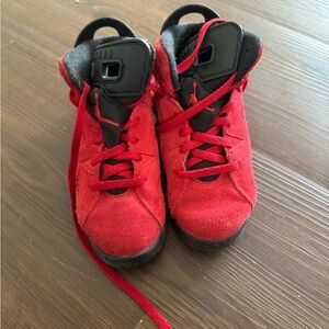 Red and black Jordans kids